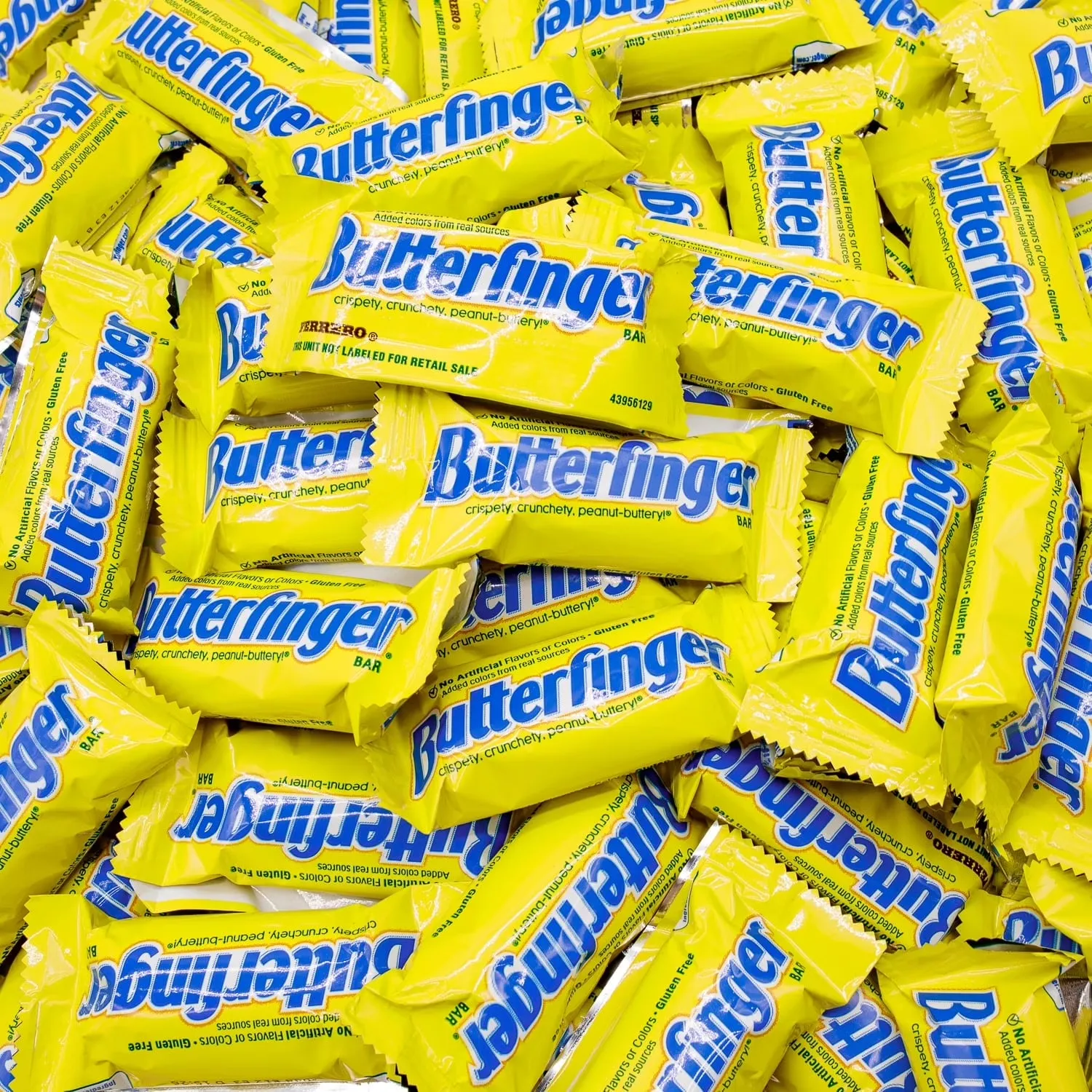 A pile of fun-size Butterfinger bars in yellow wrappers