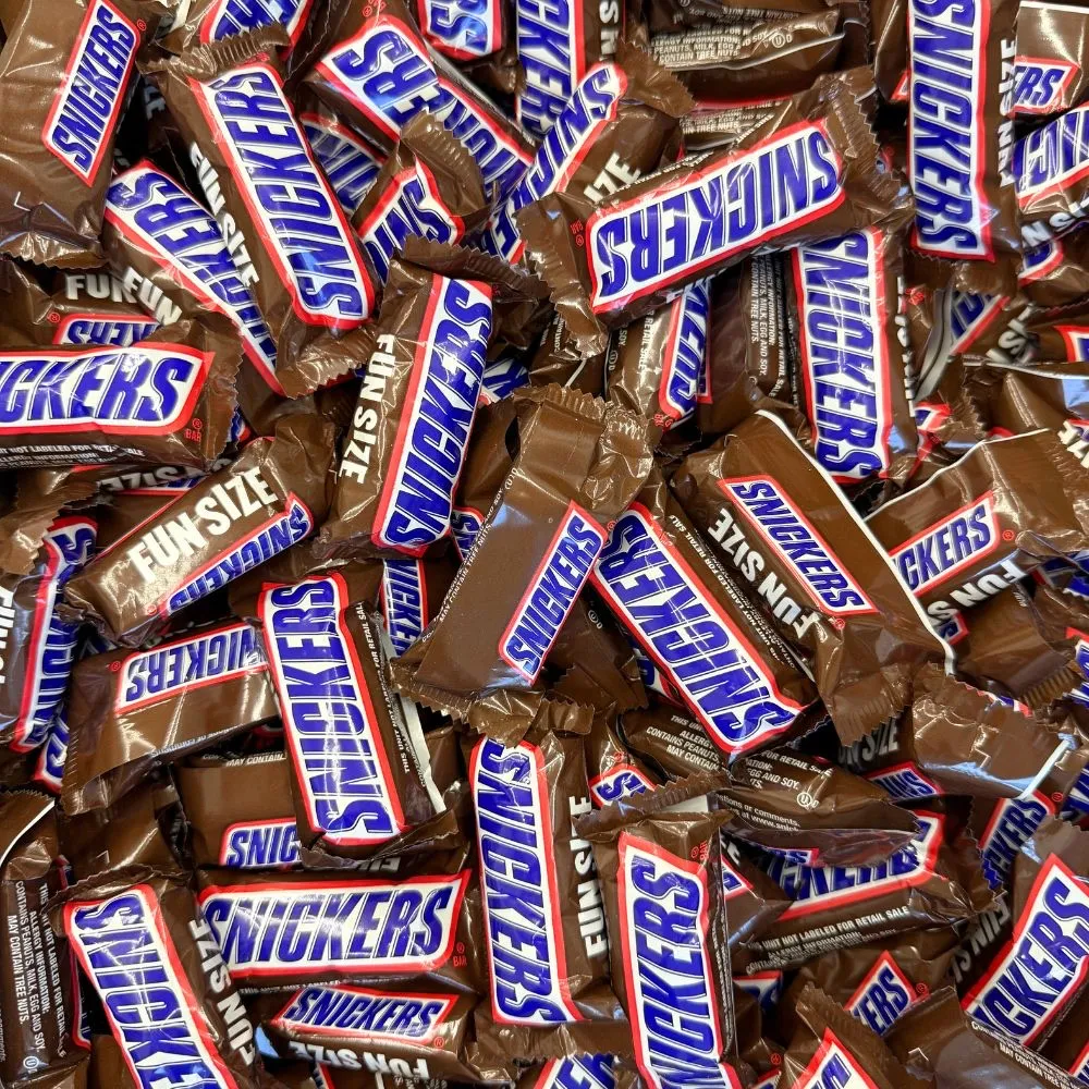 A pile of Snickers minis in brown wrappers